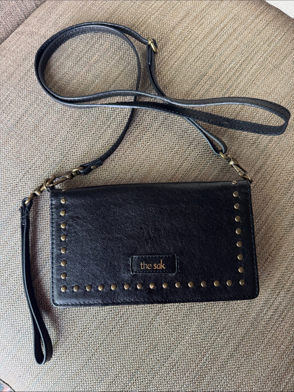 The Sak Black Leather Studded Crossbody Wallet with Gold Hardware